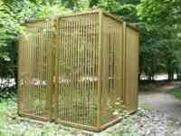 Golden cage in woods