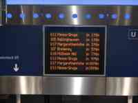 Electronic sign listing train arrival times