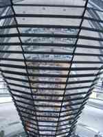 Curved conical column decorated with mirrors